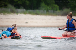 Maddie Bauer, left, and Emily Dann talk on their paddleboards at the York River in Yorktown, Va., on Thursday, July 2, 2015. In addition to kayaks and paddleboards, Patriot Tours and Provisions rents canoes, bikes, and Segways.